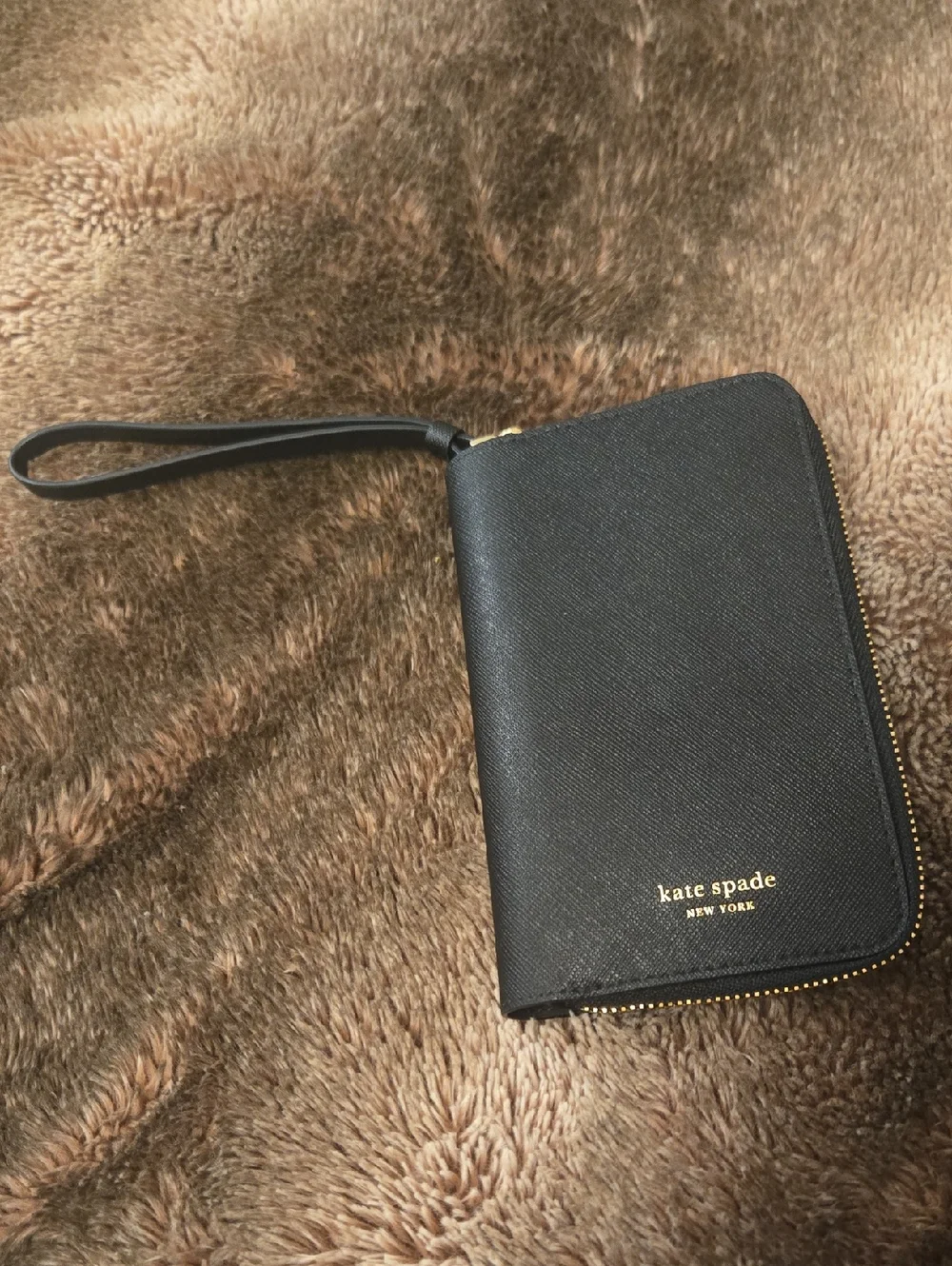 kate spade black zip around wristlet wallet with gold logo